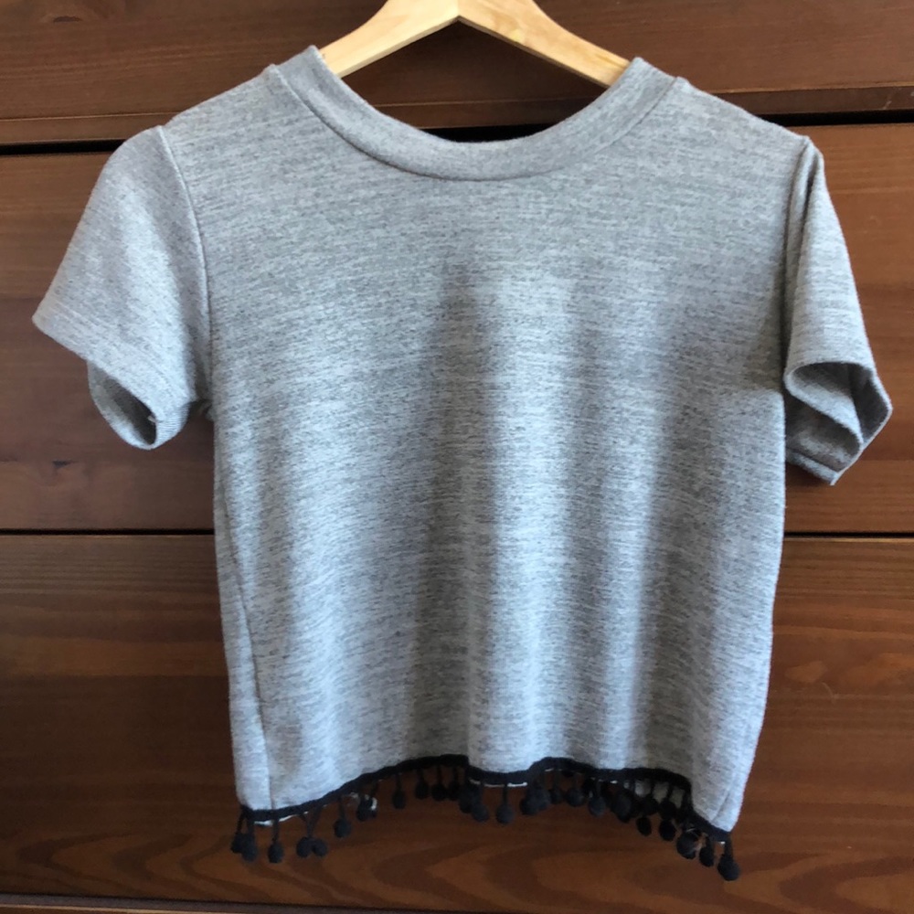 Cute open back top with fringe pompom